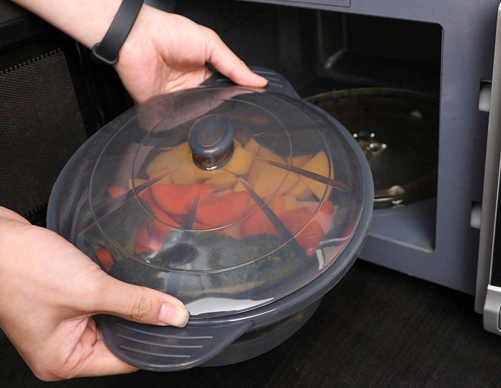 Silicone microwave food steamer cooks a variety of dishes in microwave.